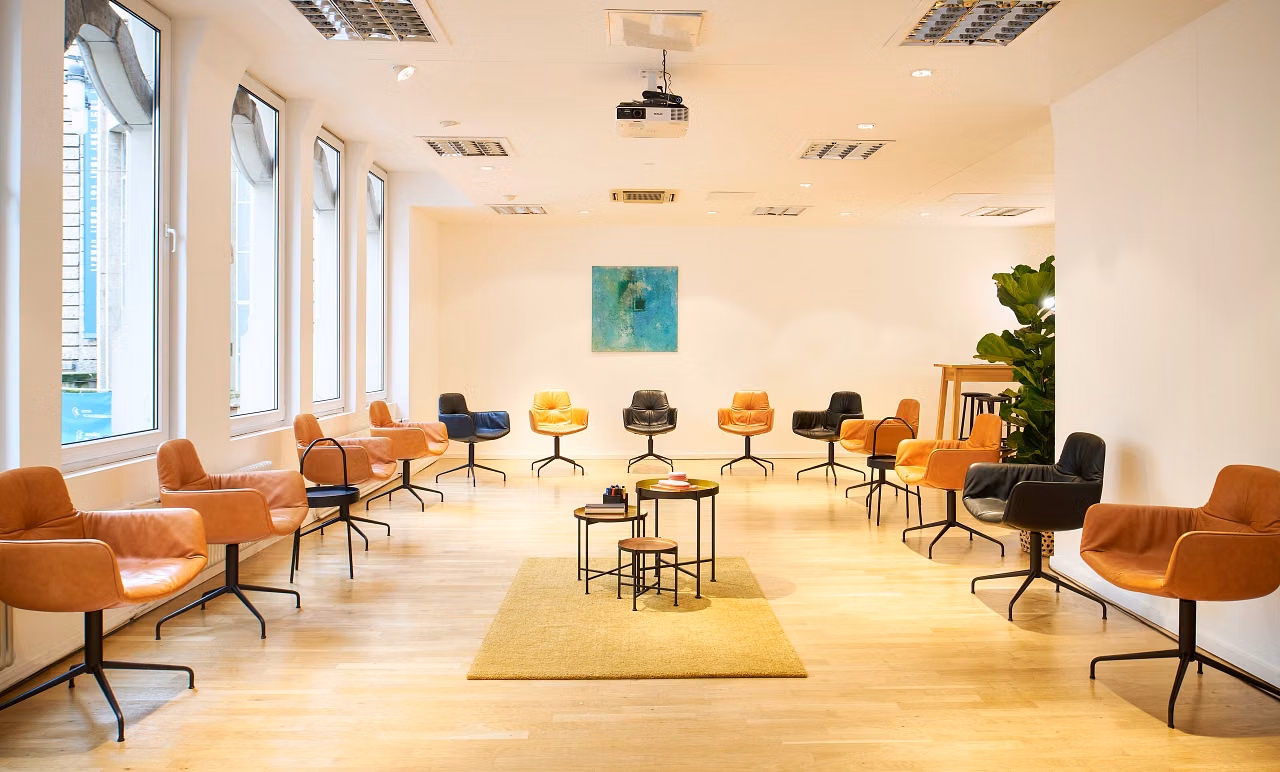 Empty meeting room with chairs arranged in a circle