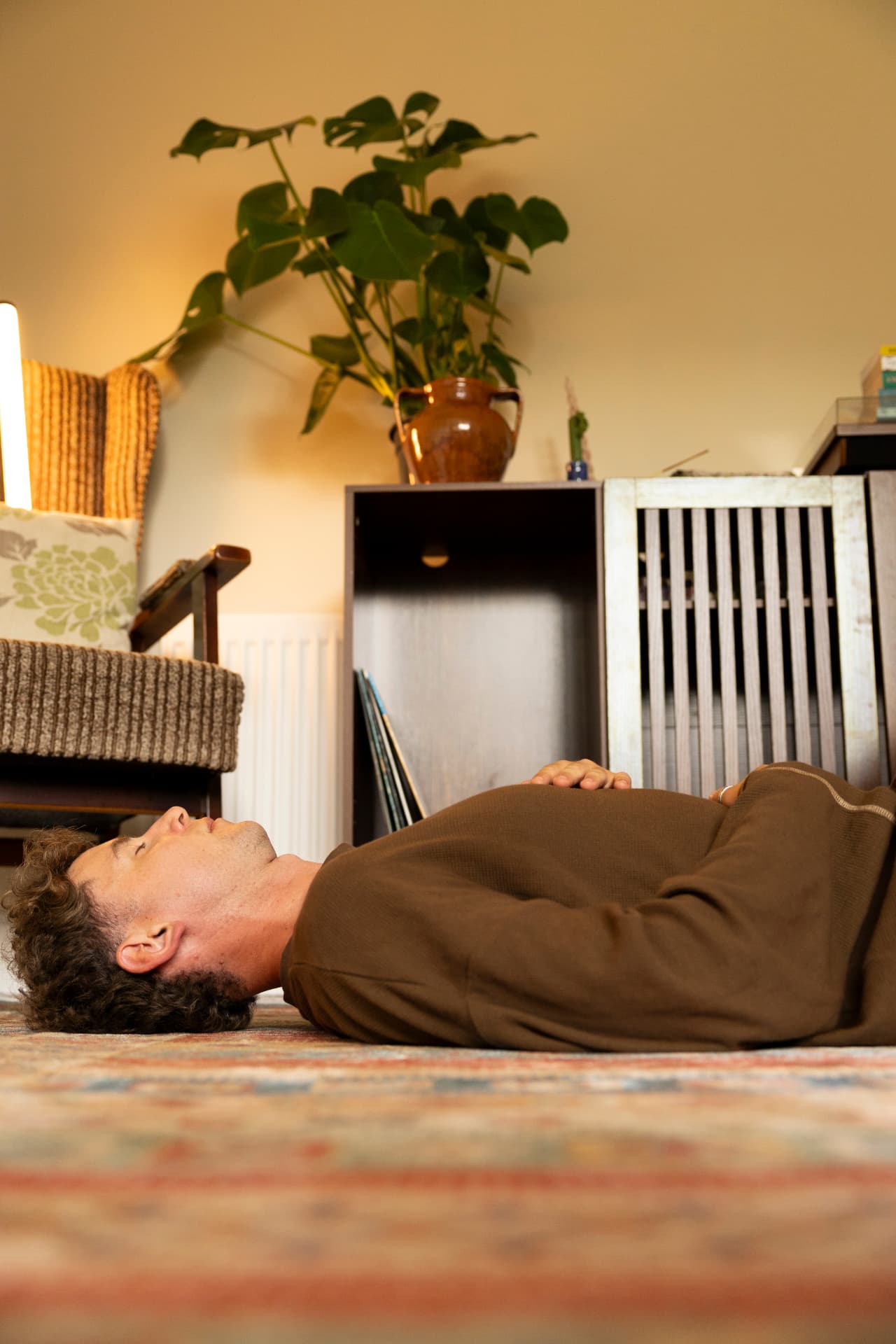 Lying down, breathing, in a warm and quiet room